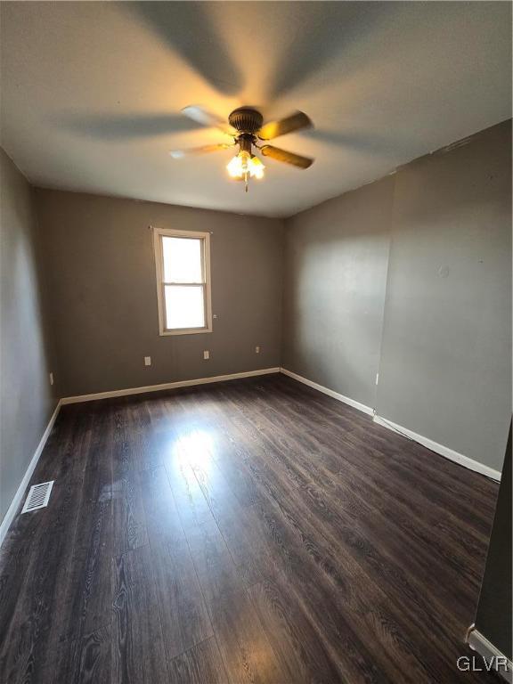1015 Oak Street Coplay, PA 18037 - Photo 17 of 23 an empty room with wooden floor and windows