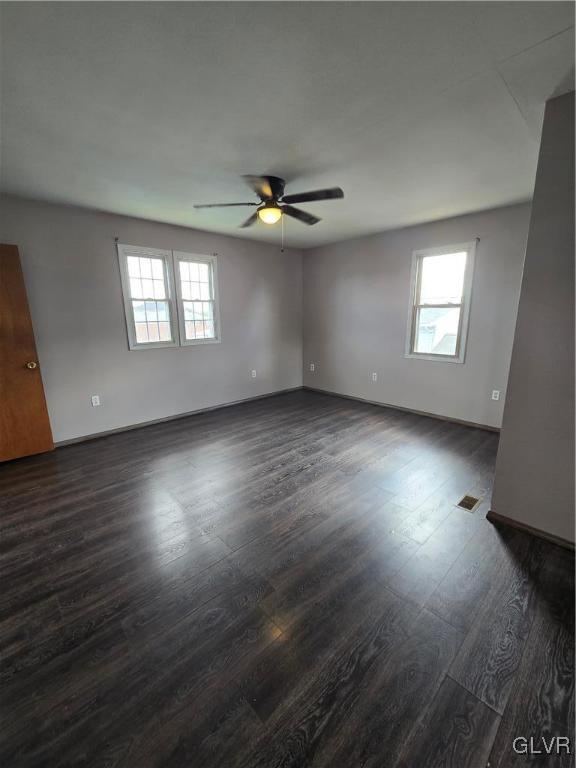 1015 Oak Street Coplay, PA 18037 - Photo 18 of 23 an empty room with wooden floor and windows