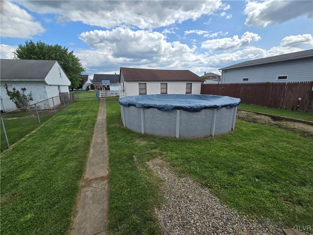 1015 Oak Street Coplay, PA 18037 - Photo 9 of 23 a view of a house with a backyard and a tub
