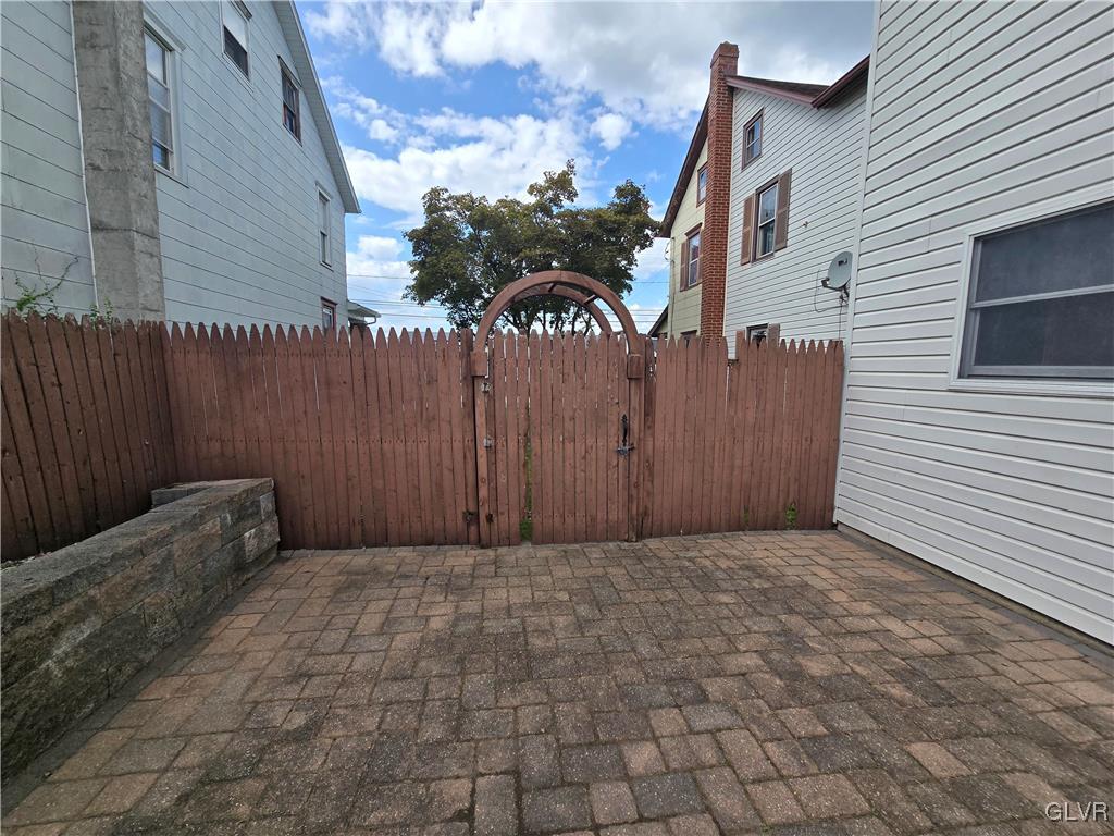 1015 Oak Street Coplay, PA 18037 - Photo 10 of 23 a view of a house with a wooden fence