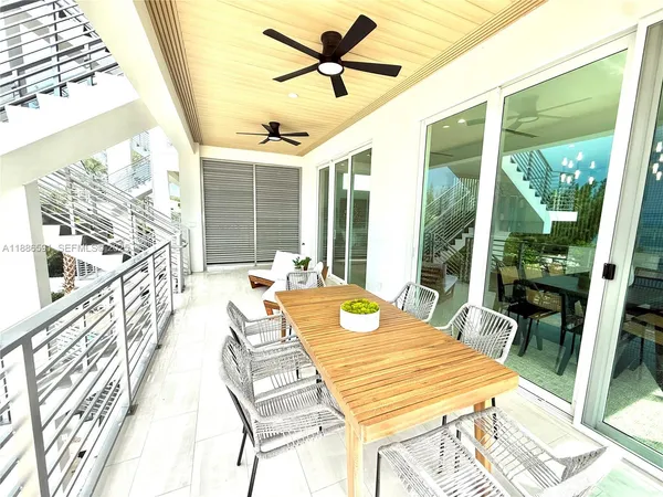 a view of a balcony dining area