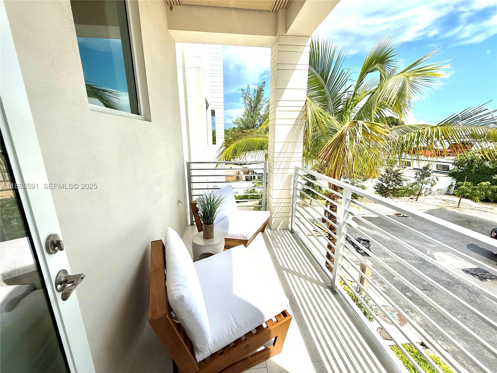 990 41st Gulf Street Marathon, FL 33050 - Photo 18 of 51 a view of a balcony with wooden floor