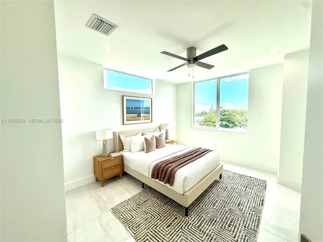 a bedroom with a bed and a walk in closet