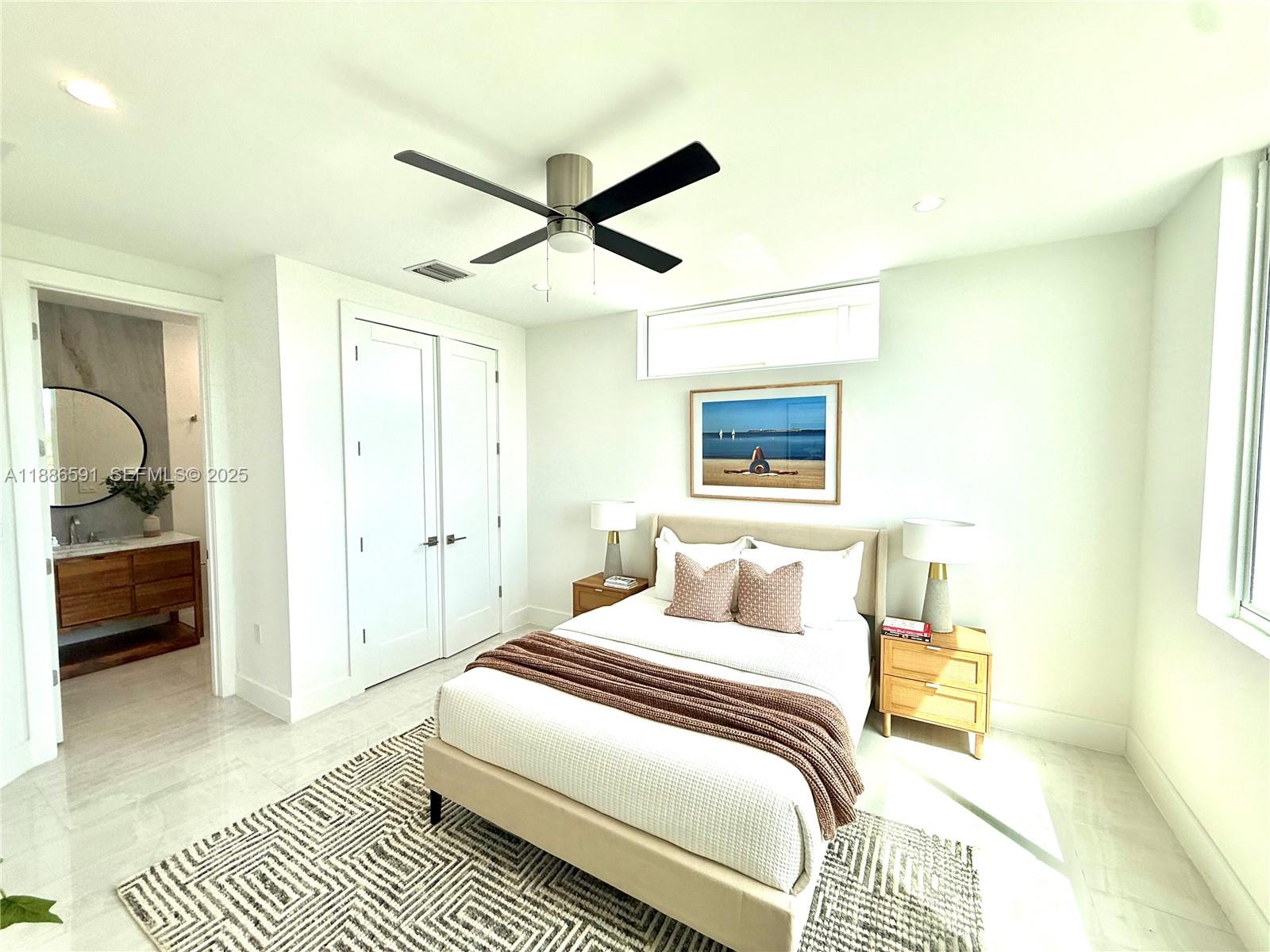 990 41st Gulf Street Marathon, FL 33050 - Photo 23 of 51 a bedroom with a bed and a walk in closet