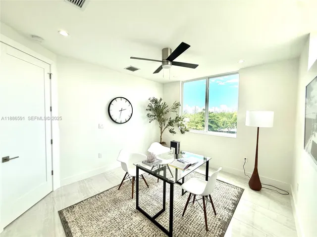a bathroom with a bathtub shower sink vanity and toilet