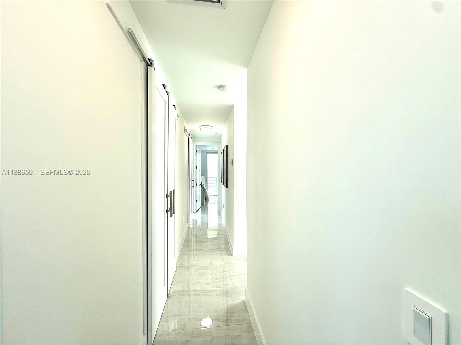 990 41st Gulf Street Marathon, FL 33050 - Photo 28 of 51 a view of a bathroom from a hallway