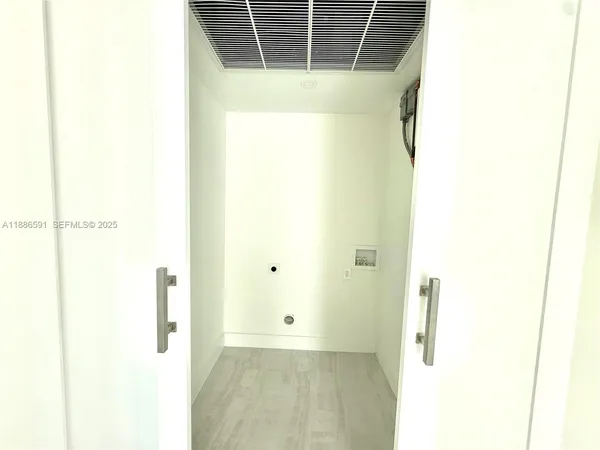 a bedroom with a large bed and a rug
