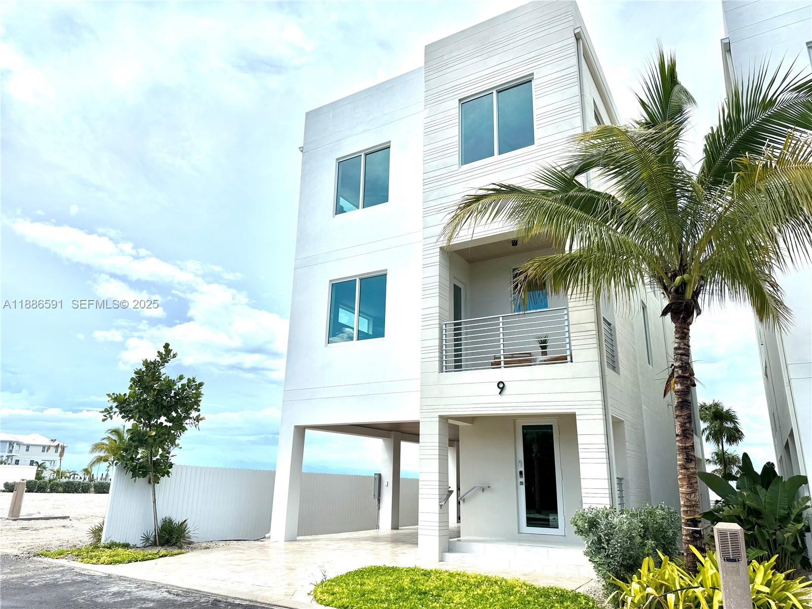 990 41st Gulf Street Marathon, FL 33050 - Photo 3 of 51 a front view of a house with a yard