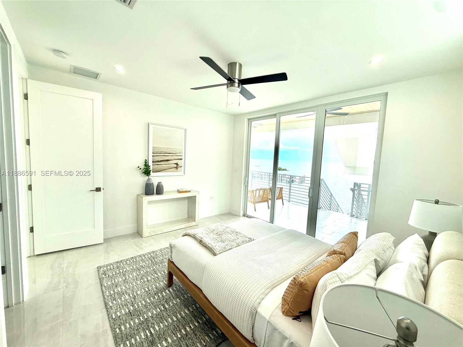 990 41st Gulf Street Marathon, FL 33050 - Photo 31 of 51 a bedroom with a bed and glass walk in closet