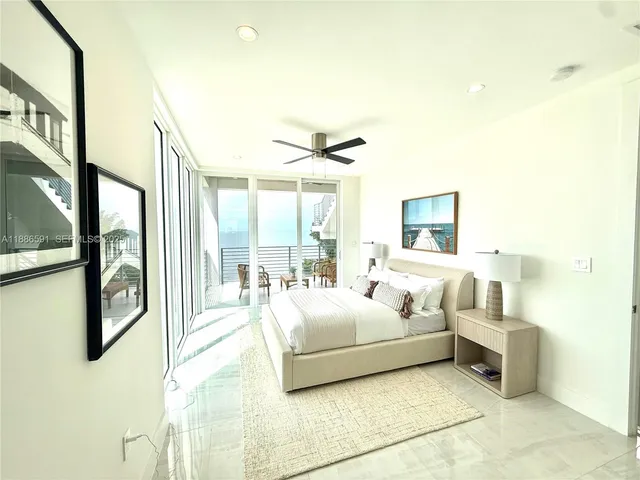 a bathroom with a sink and mirror with toilet