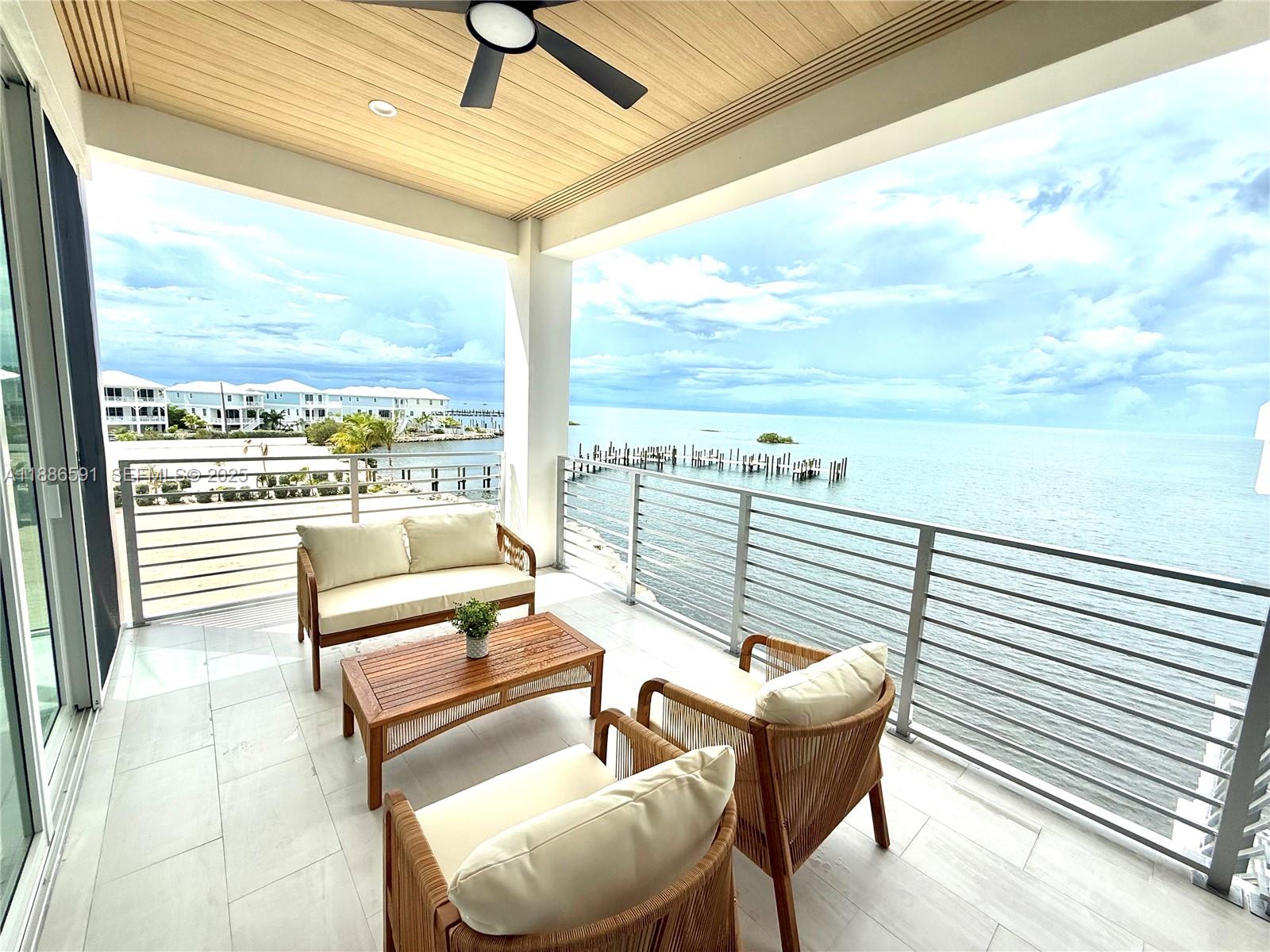 990 41st Gulf Street Marathon, FL 33050 - Photo 36 of 51 a balcony with furniture and city view