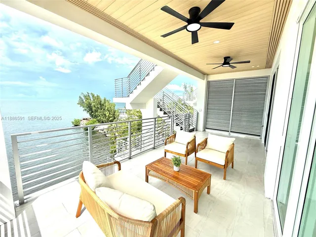 a view of swimming pool with an outdoor seating