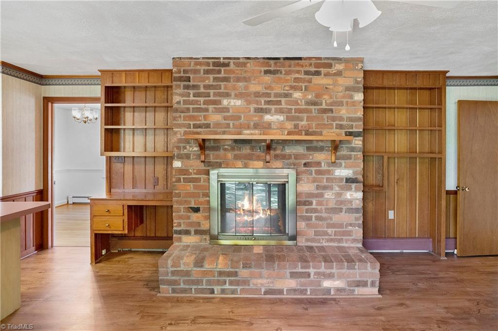 310 Doub Road Lewisville, NC 27023 - Photo 19 of 31 Built in shelves and wood burning brick fireplace