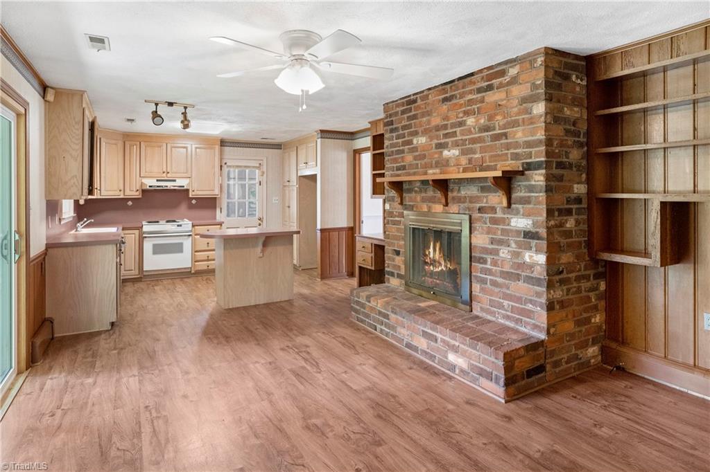 310 Doub Road Lewisville, NC 27023 - Photo 20 of 31 Den with hardwood floors and builtin shelves