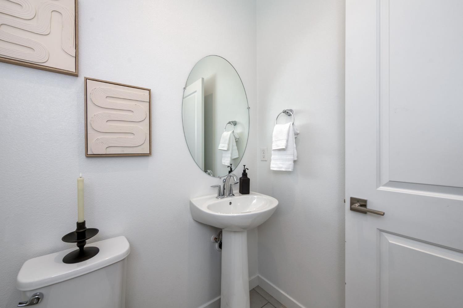 4670 Terrace Road Madera, CA 93636 - Photo 19 of 53 a bathroom with a sink a mirror and shower