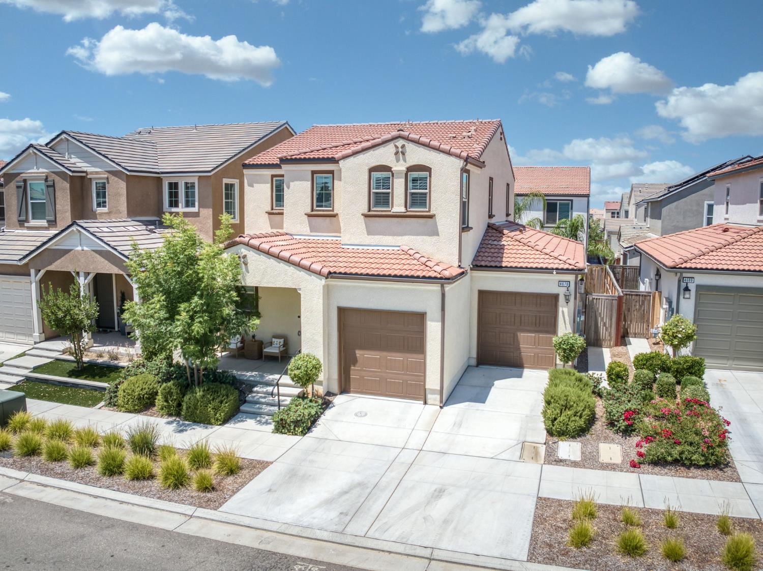 4670 Terrace Road Madera, CA 93636 - Photo 40 of 53 a front view of a house with a garden