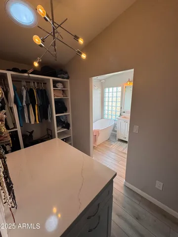 a view of hallway with wooden floor