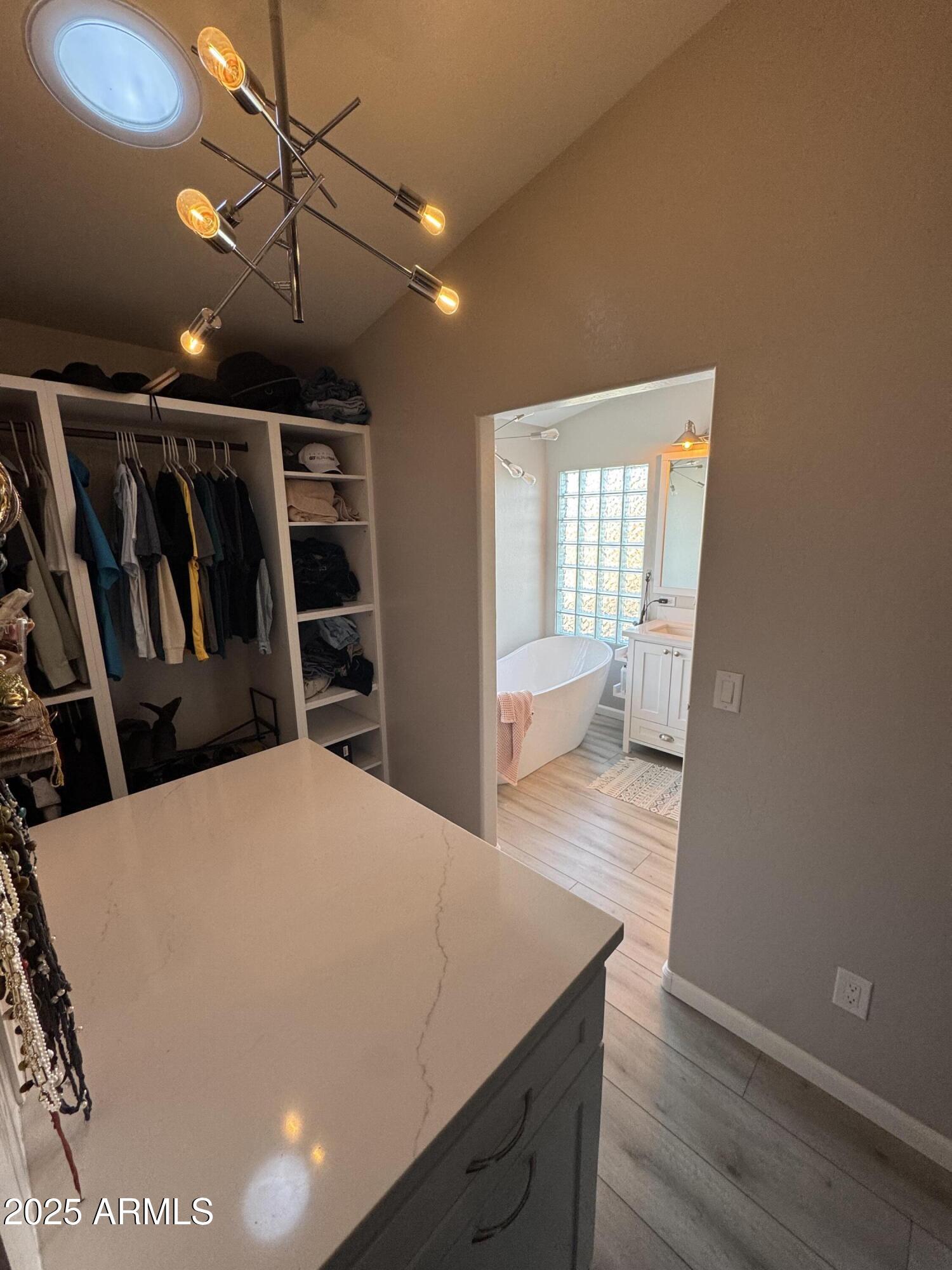 13781 West Vernon Avenue Goodyear, AZ 85395 - Photo 14 of 25 a view of hallway with wooden floor
