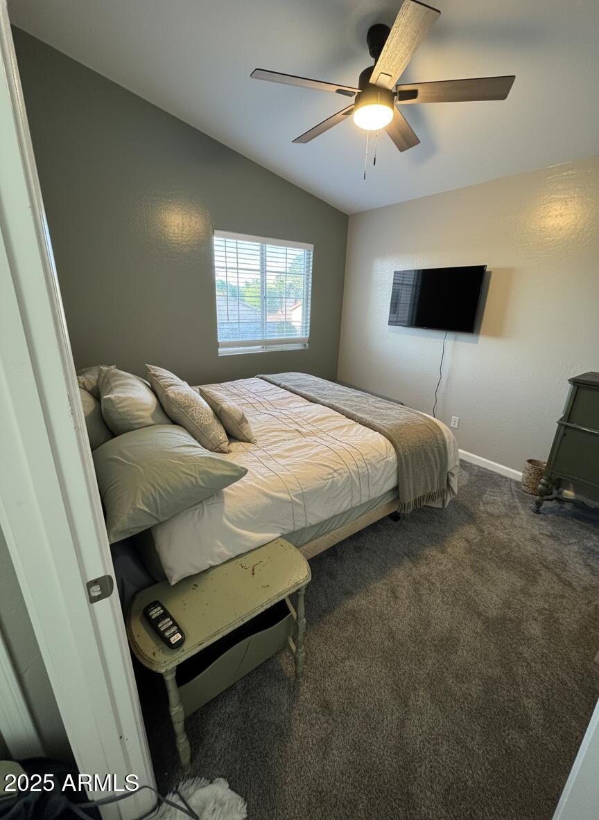 13781 West Vernon Avenue Goodyear, AZ 85395 - Photo 15 of 25 a bedroom with a bed and a window