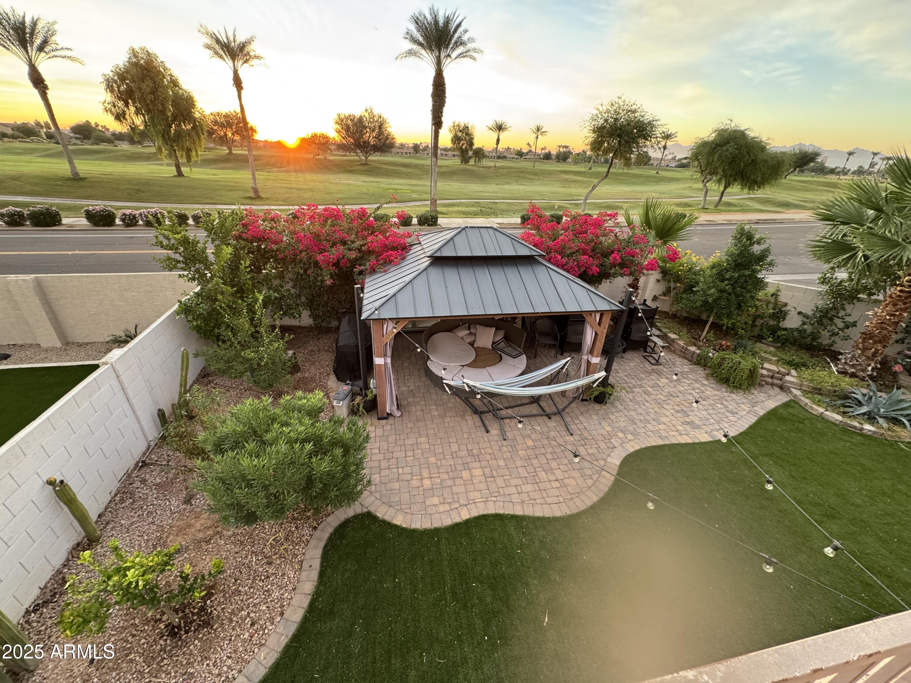 13781 West Vernon Avenue Goodyear, AZ 85395 - Photo 22 of 25 a view of a swimming pool with a patio and a garden