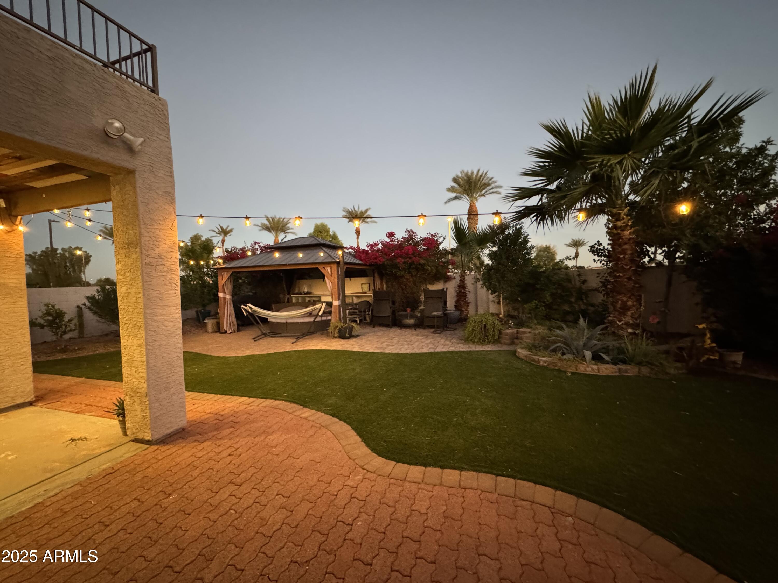 13781 West Vernon Avenue Goodyear, AZ 85395 - Photo 23 of 25 a view of a house with backyard porch and garden
