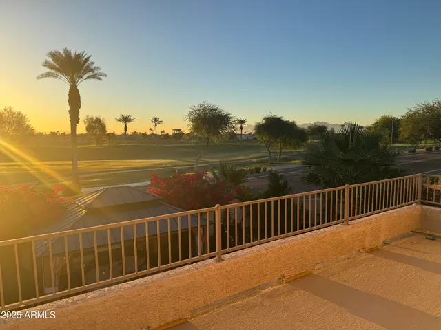 a view of a balcony with ocean view