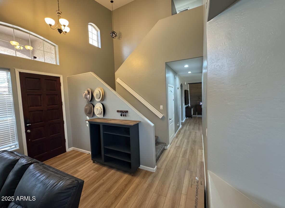 13781 West Vernon Avenue Goodyear, AZ 85395 - Photo 3 of 25 a view of entryway and hall with wooden floor