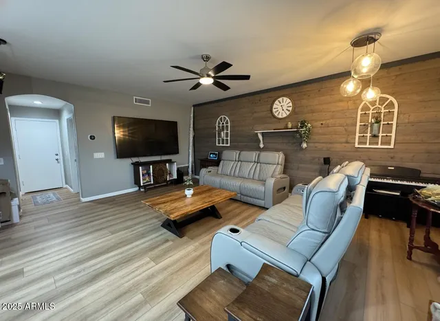 a living room with furniture and a flat screen tv