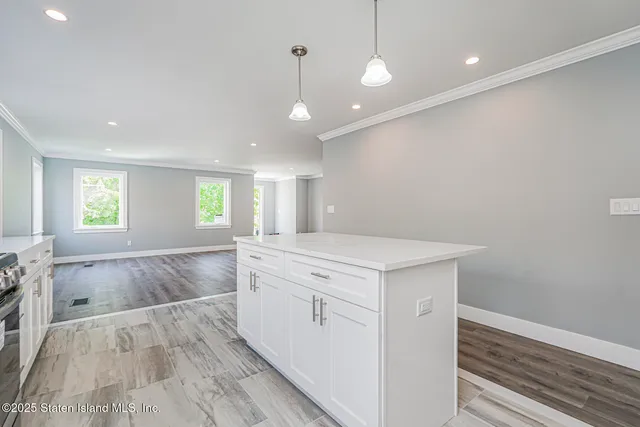 a view of a kitchen cabinets and wooden floor