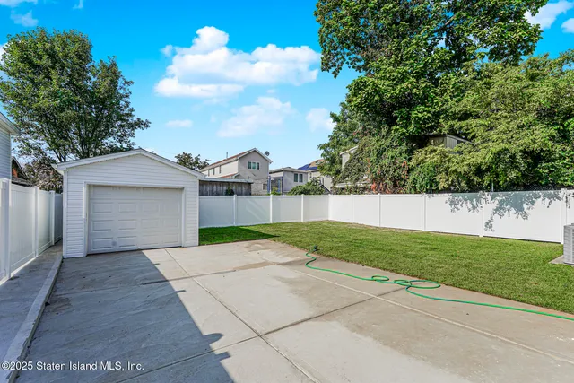 a view of backyard with green space