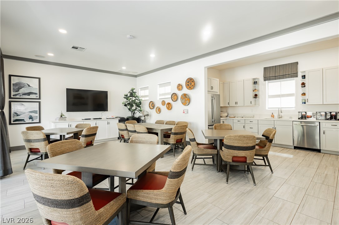 2555 Hampton Road, Unit 3308 Henderson, NV 89052 - Photo 53 of 65 A well-lit communal space with ample seating, featuring a modern kitchen perfect for entertaining.
