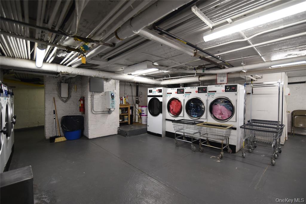 83-52 Talbot Street, Unit 5C Queens, NY 11415 - Photo 22 of 22 a utility room with dryer and washer