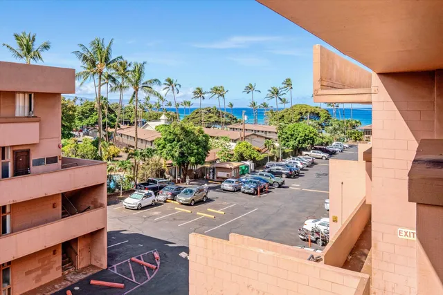 a view of a chairs and table in a backyard