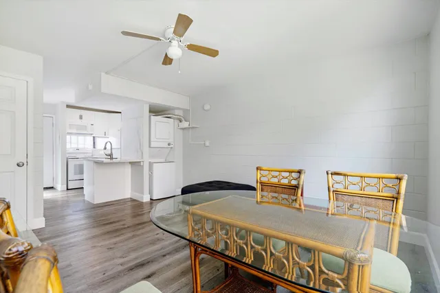 a view of kitchen with furniture and wooden floor