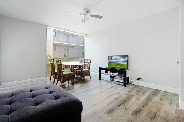 a reading room with furniture and wooden floor