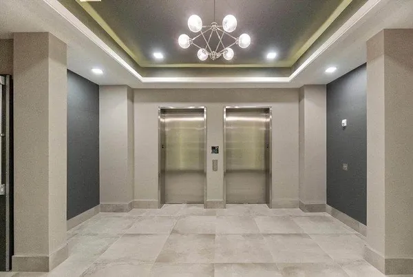 a room with wooden floor and gym equipment