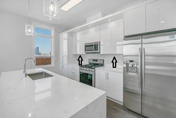 a kitchen with a refrigerator stove and sink