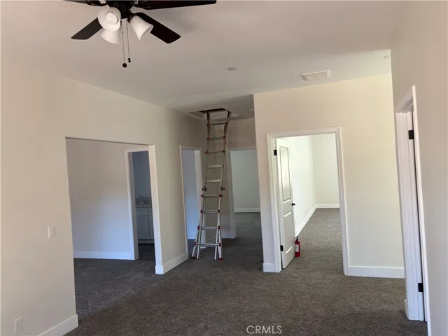 a view of empty room with a large window