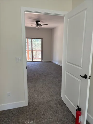 a view of outdoor space with wooden floor and windows