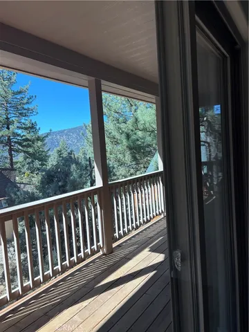 a view of balcony with wooden floor
