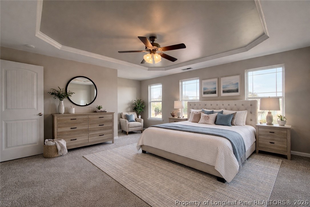 Undisclosed Address Spring Lake, NC 28390 - Photo 24 of 50 a spacious bedroom with a bed and a chandelier