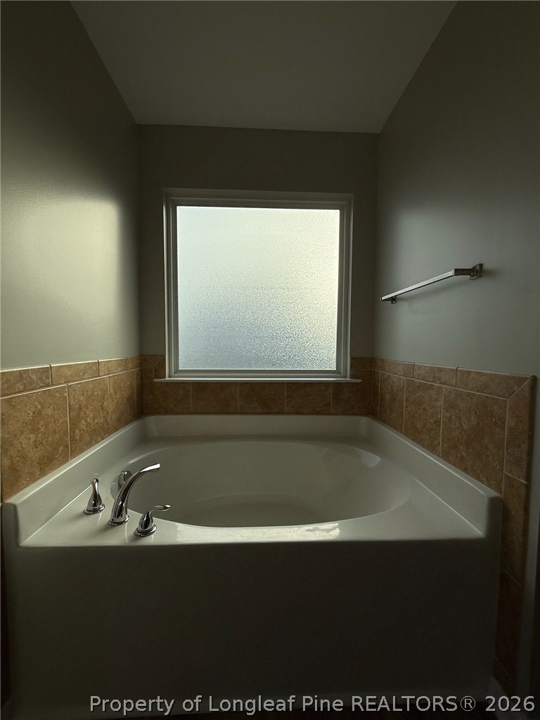 Undisclosed Address Spring Lake, NC 28390 - Photo 28 of 50 a bathroom with a bathtub