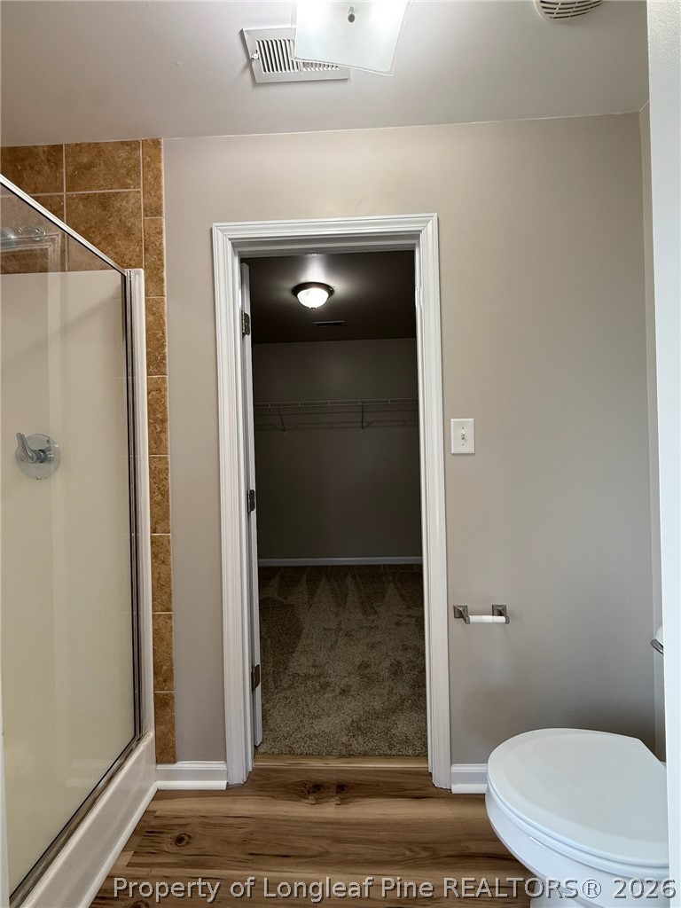 Undisclosed Address Spring Lake, NC 28390 - Photo 31 of 50 a bathroom with a toilet and a shower