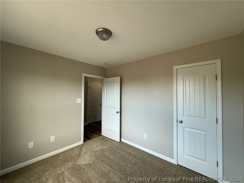 Undisclosed Address Spring Lake, NC 28390 - Photo 40 of 50 an empty room with closet area