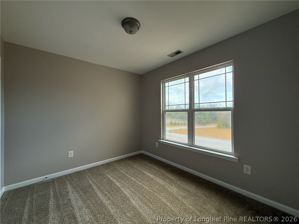 Undisclosed Address Spring Lake, NC 28390 - Photo 42 of 50 an empty room with a window
