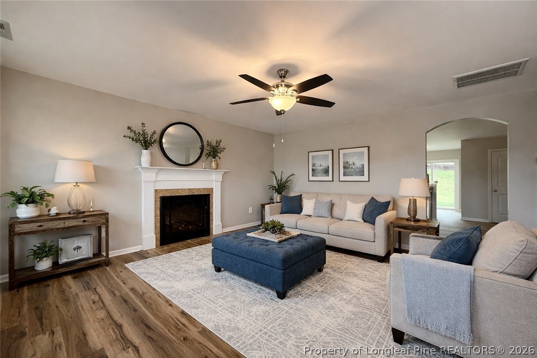 Undisclosed Address Spring Lake, NC 28390 - Photo 6 of 50 a living room with furniture a fireplace and a flat screen tv