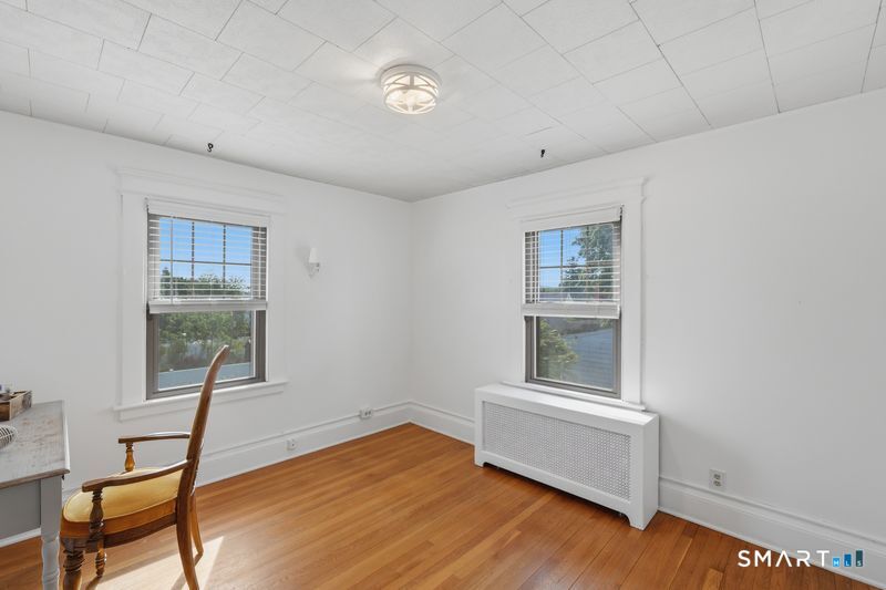 443 Highland Avenue Waterbury, CT 06708 - Photo 14 of 24 a room with furniture and a window