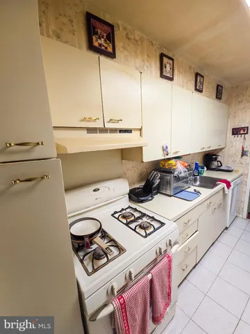 a kitchen with a stove and a refrigerator