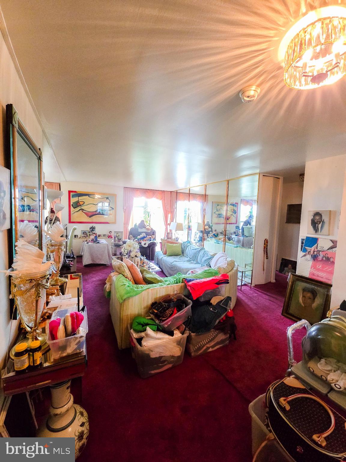 3600 Conshohocken Avenue, Unit 1804 Philadelphia, PA 19131 - Photo 4 of 10 a living room with furniture and a gym