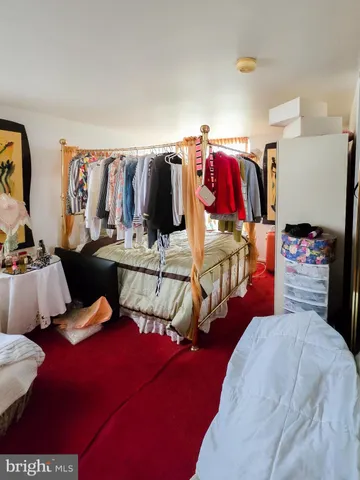 a bedroom with a bed and a walk in closet